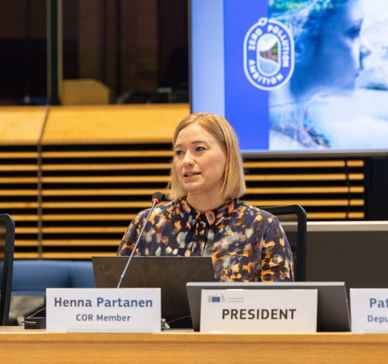 Co-Chair Henna Partanen seated in the podium of the Zero-Pollution Stakeholder Platform meeting.